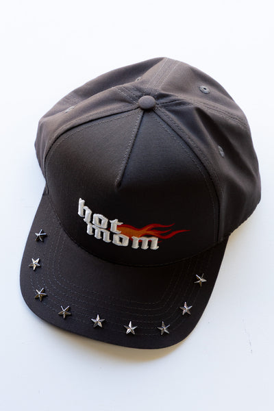 Black cap with 'hot mom' text and star embellishments on a white background