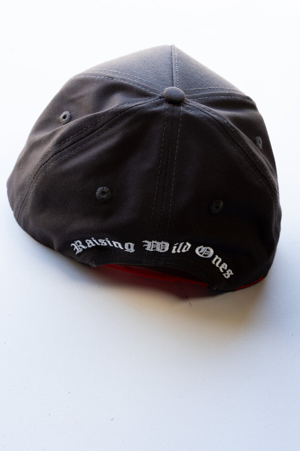 Black cap with 'Raising Wild Ones' text on a white background