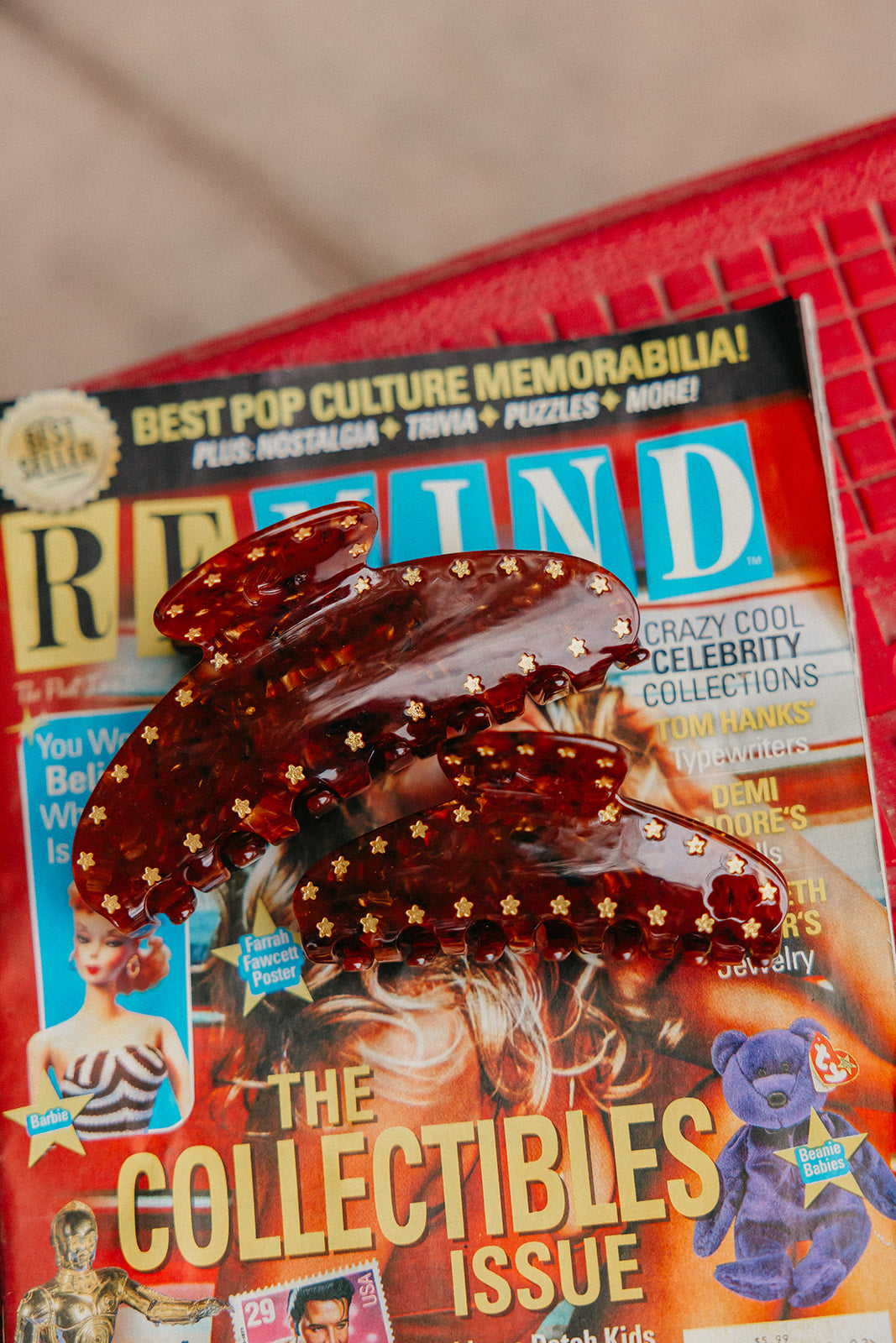Two tortoise claw clips resting on a magazine.