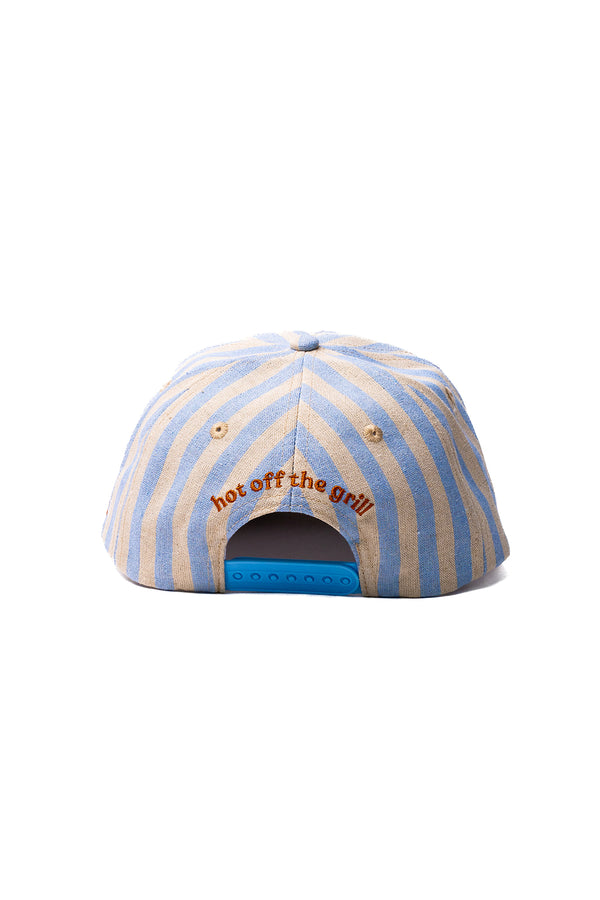 Striped cap with 'hot off the grill' text on a white background