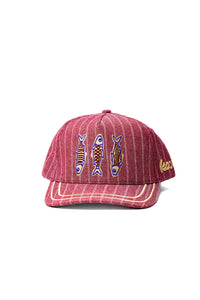 Red striped cap with fish designs on a white background