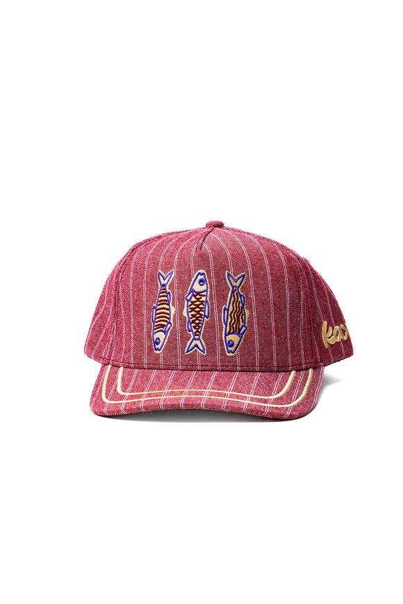 Red striped cap with fish designs on a white background
