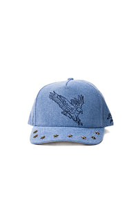 denim blue trucker hat with an eagle embroidered on the front, and studs on the brim 